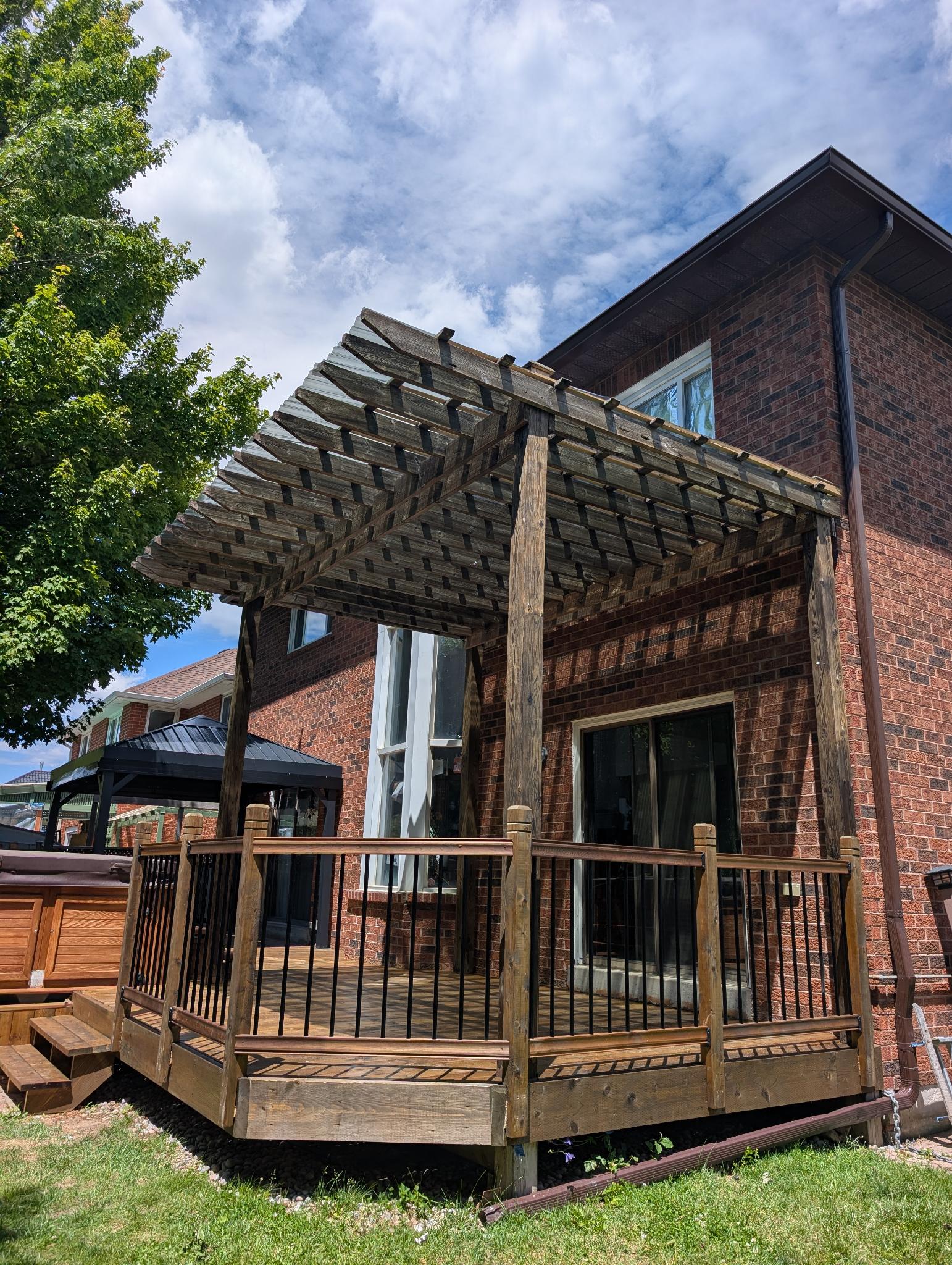 Deck with pergola before — weathered grey boards